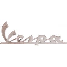 Emblem / Nápis "Vespa" 2 kolíky, rozteč děr 120x35mm, 105mm pro Vespa Sprint / Super / Rally